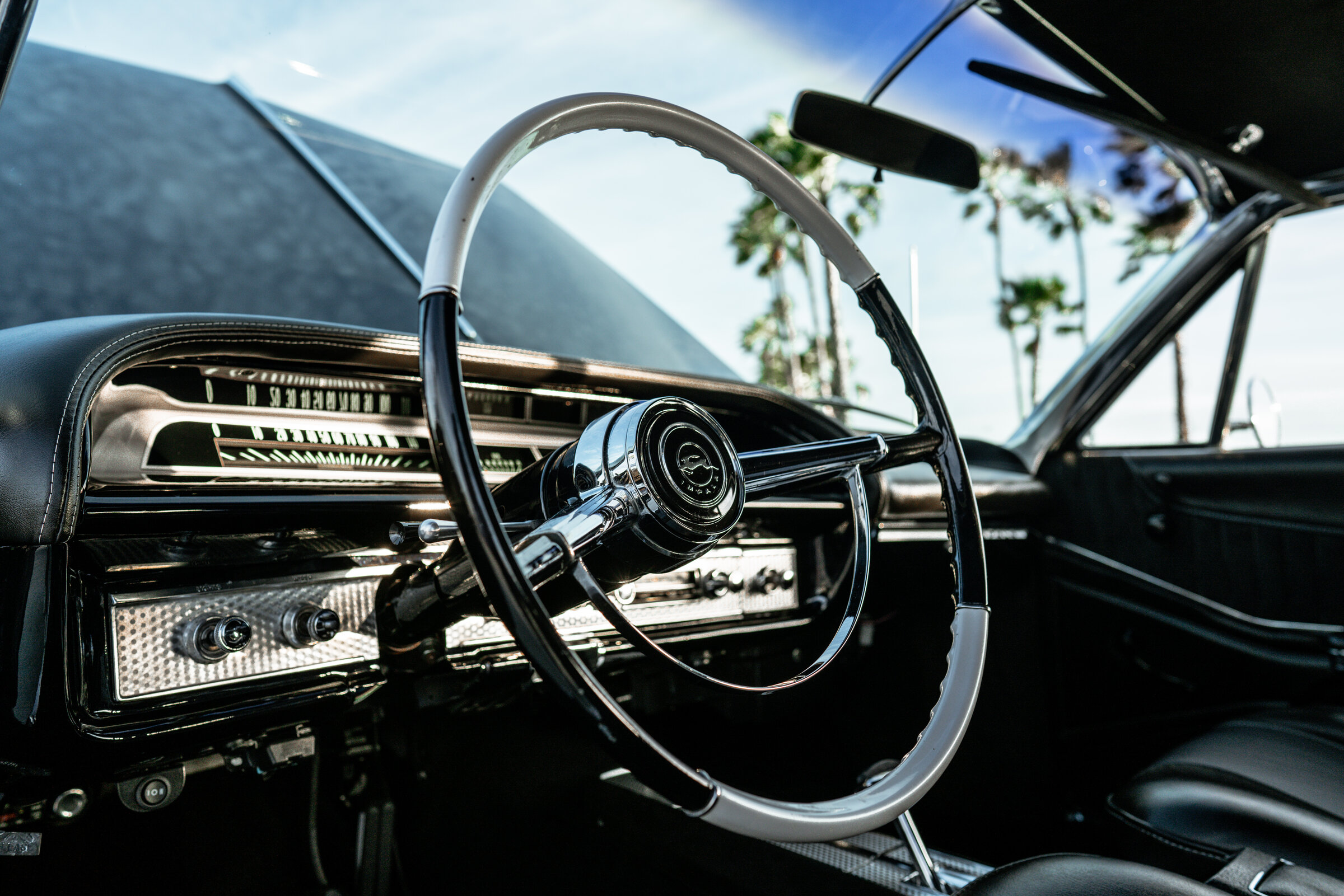 Classic car cockpit with palm trees