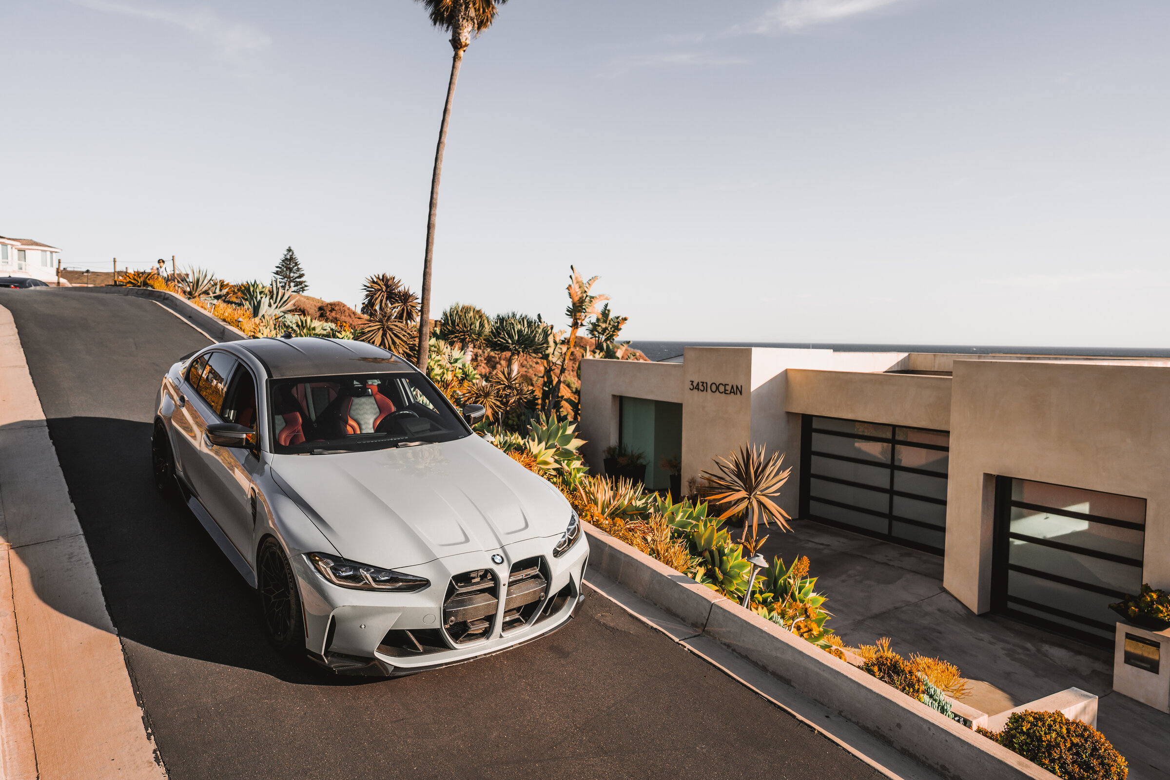 Sports sedan on a coastal driveway