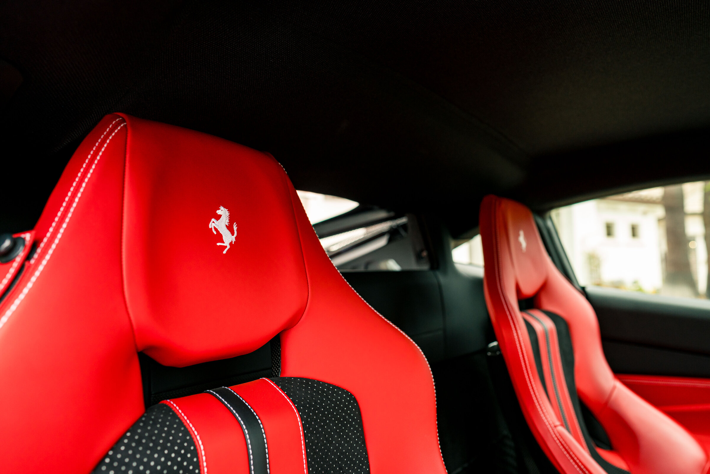 Ferrari interior with red racing seats