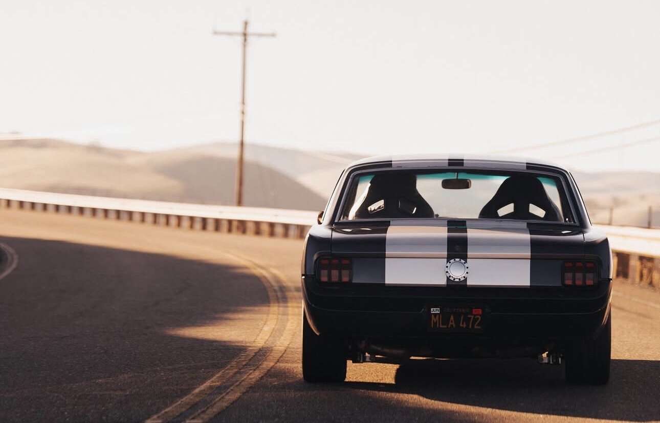 Vintage fastback on a mountain road